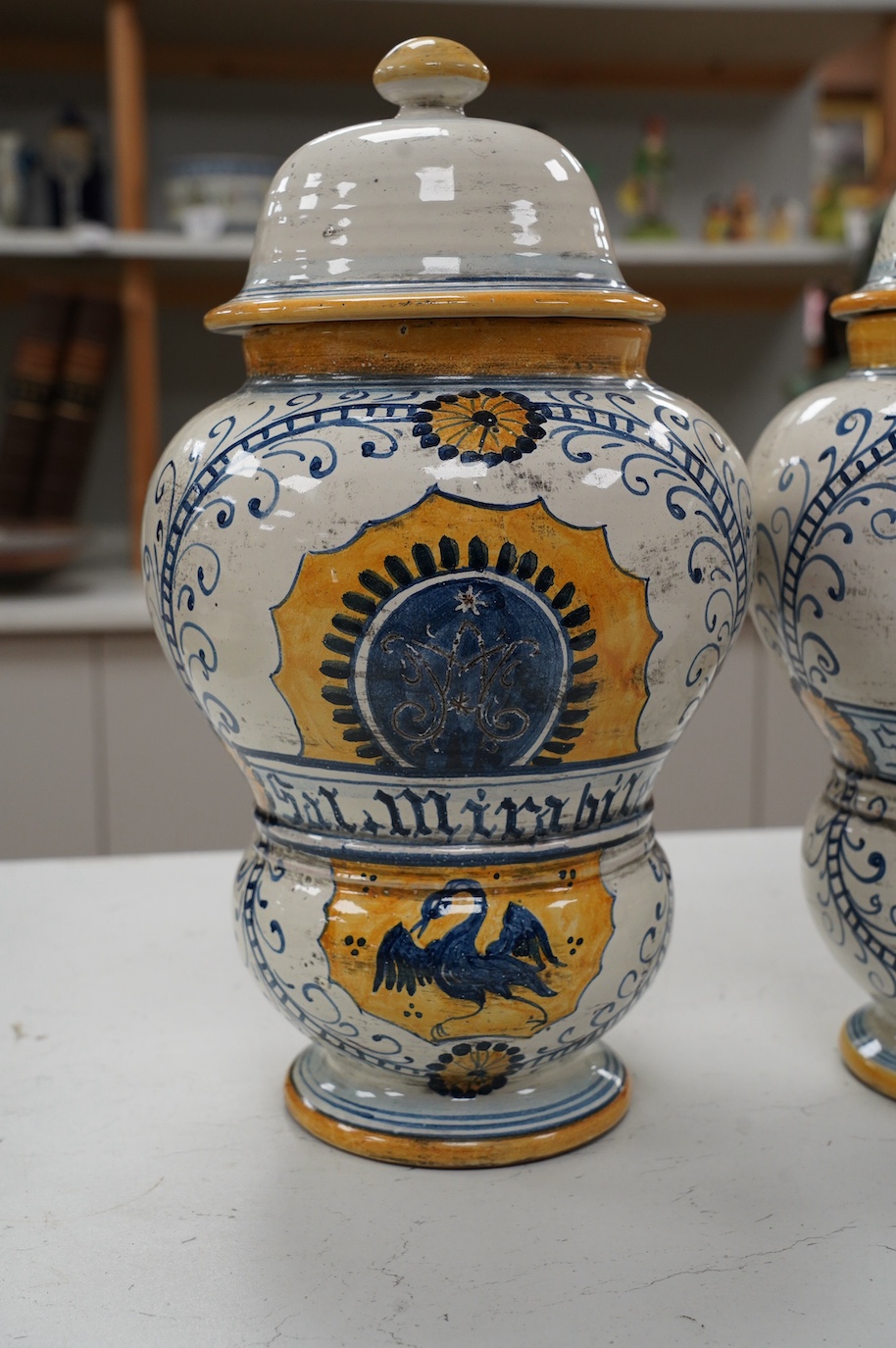 A pair of 17th century style maiolica drug jars and covers, 34cm. Condition - good